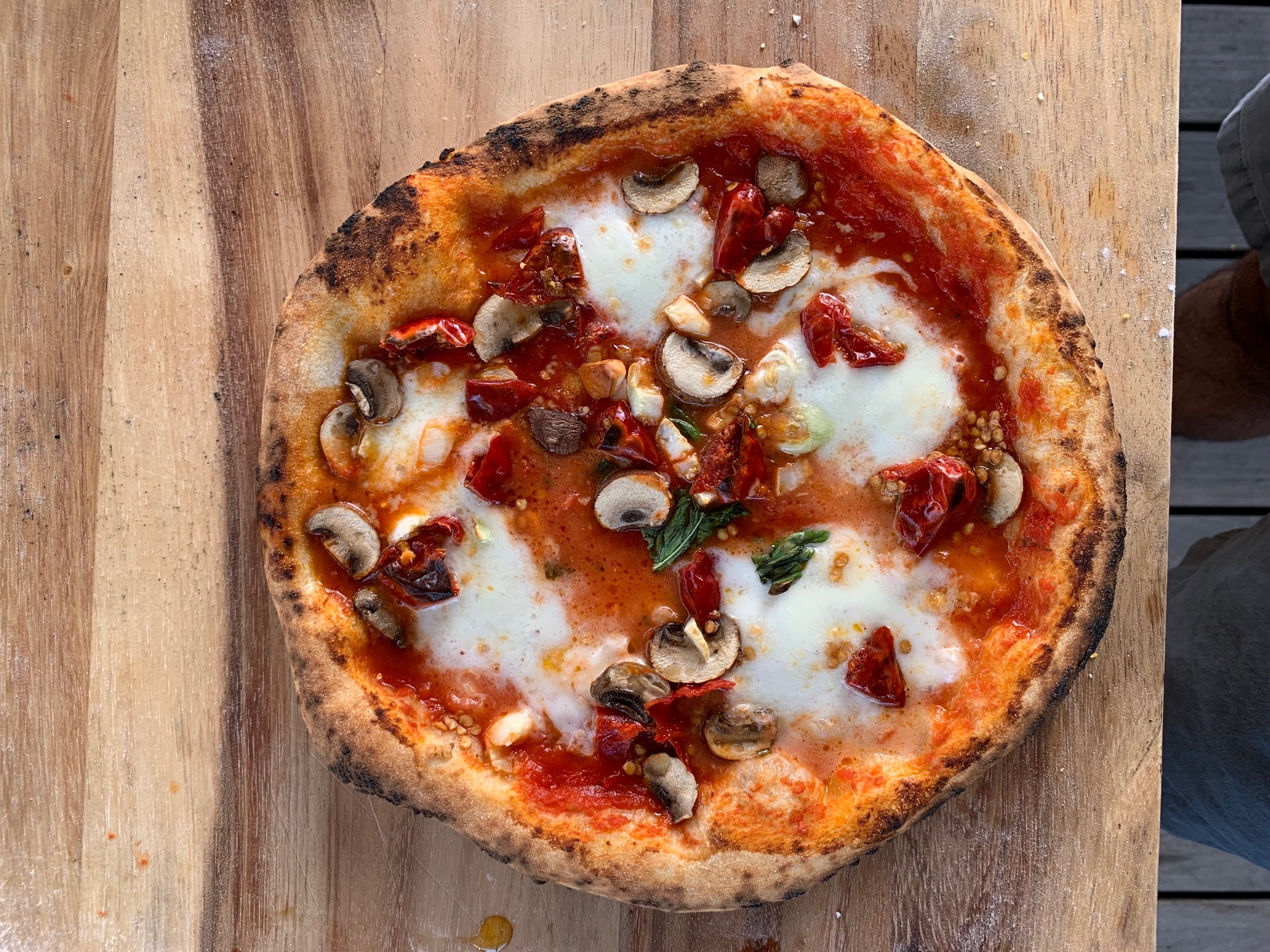 margarita pizza with calabrisi, mushrooms, mozzarella and basil