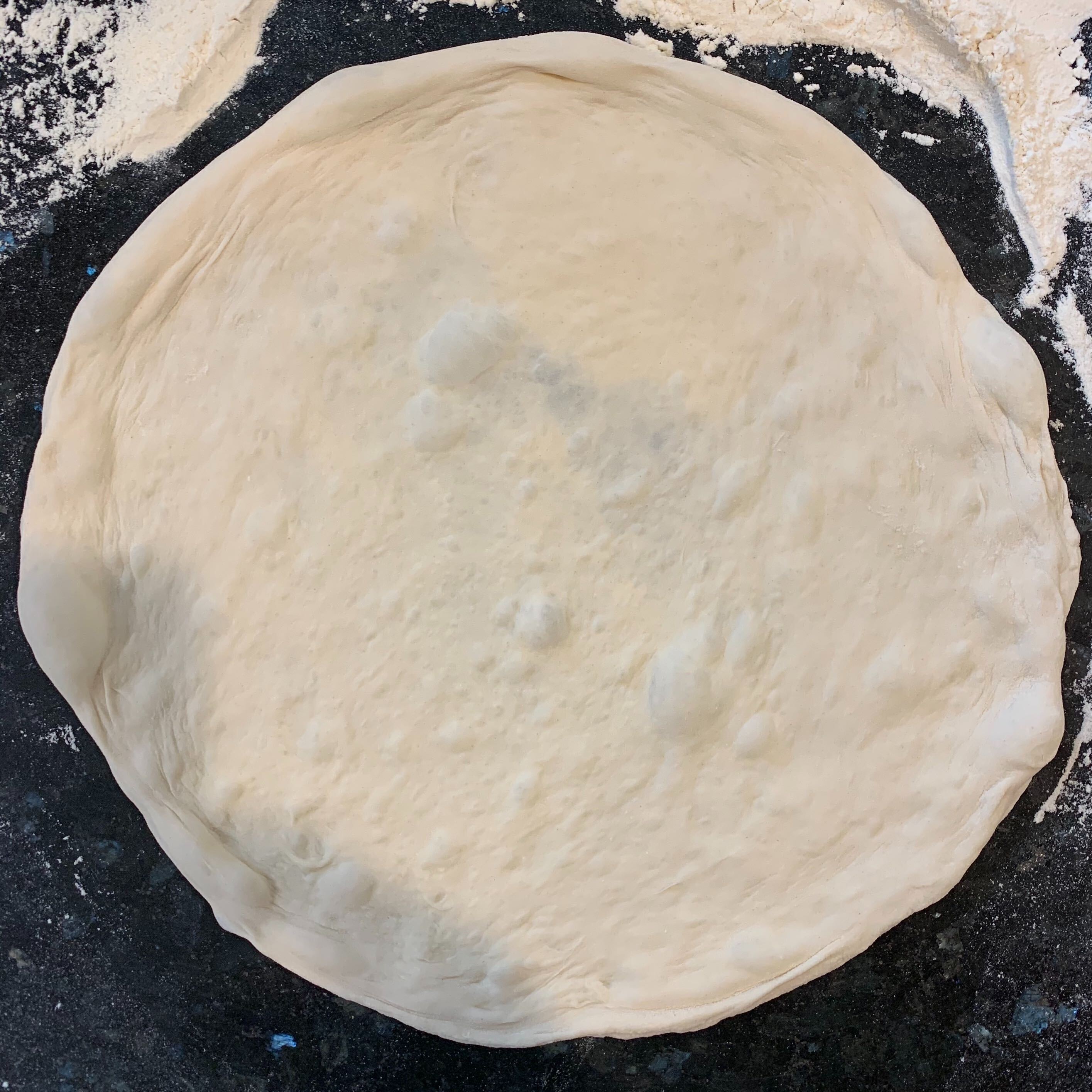 rolled dough ready to be sauced